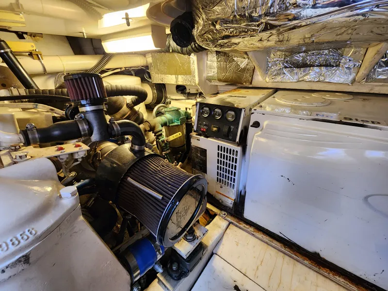 Slide: The Image of Engine room of a 2005 Tiara Yachts 3800 Open with visible machinery and components. - 33