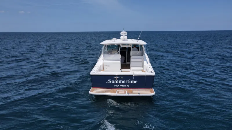 Slide: The Image of 2005 Tiara Yachts 3800 Open boat named Sommertime on open water. - 5