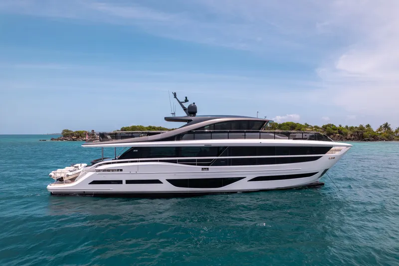 Slide: The Image of Luxurious 2021 Princess X95 yacht cruising in clear blue waters near a tropical island. - 12