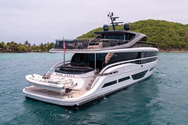 Slide: The Image of Luxurious 2021 Princess X95 yacht anchored near tropical island, featuring sleek design and spacious deck. - 13