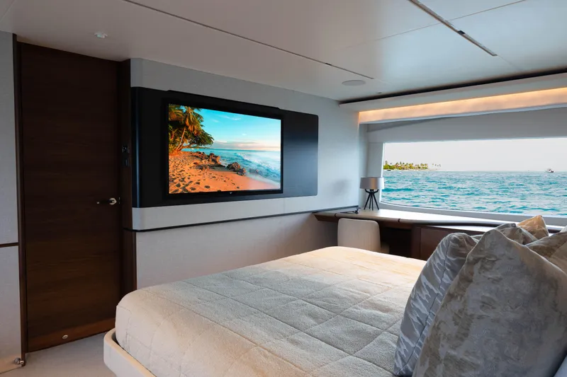 Slide: The Image of Luxurious 2021 Princess X95 yacht bedroom with ocean view and wall-mounted TV. - 2