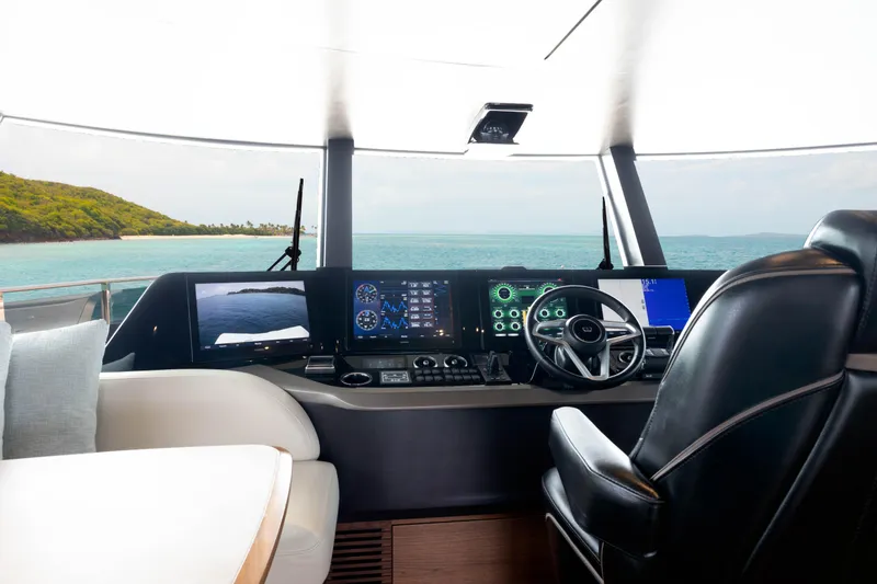 Slide: The Image of Luxurious 2021 Princess X95 yacht cockpit with advanced navigation systems and ocean view. - 25