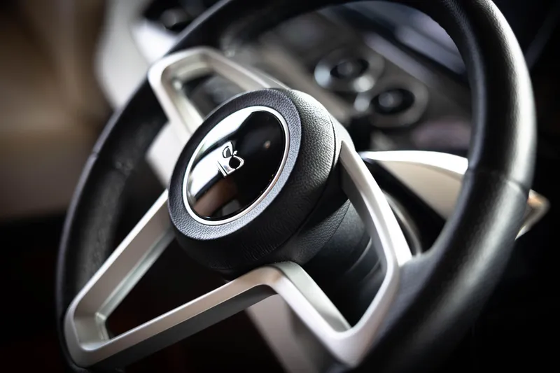 Slide: The Image of Steering wheel of 2021 Princess X95 yacht, featuring sleek design and luxury details. - 26