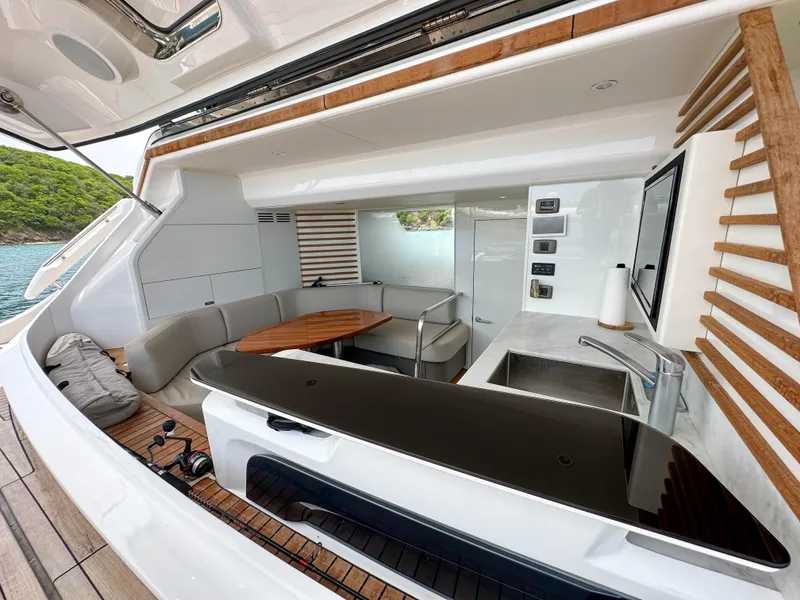 Slide: The Image of Luxurious 2021 Princess X95 yacht interior with modern kitchen and seating area. - 3