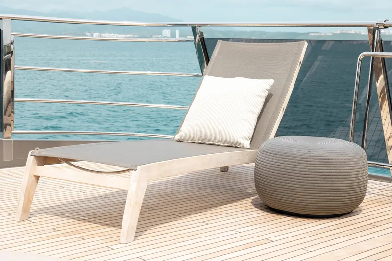 Slide: The Image of Sun lounger and ottoman on Princess X95 yacht deck, overlooking the ocean. - 33