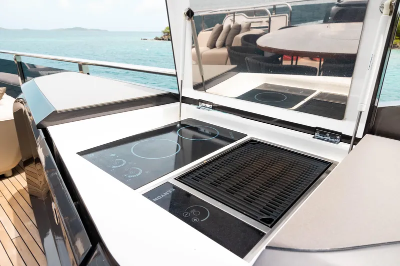Slide: The Image of Outdoor kitchen on 2021 Princess X95 yacht with grill and cooktop, overlooking ocean. - 35