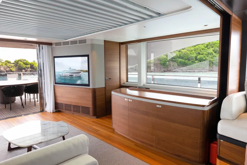 Slide: The Image of Luxurious interior of 2021 Princess X95 yacht with elegant wood finishes and ocean view. - 38