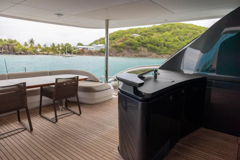 Slide: The Image of Luxury yacht Princess X95 2021 deck with seating, table, and ocean view. - 42