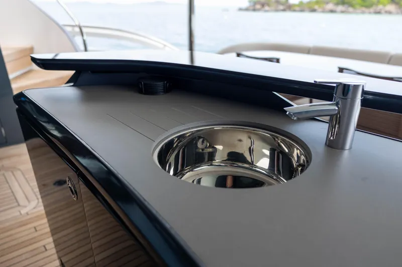 Slide: The Image of Luxury yacht Princess X95 2021, featuring sleek outdoor sink and faucet design. - 43