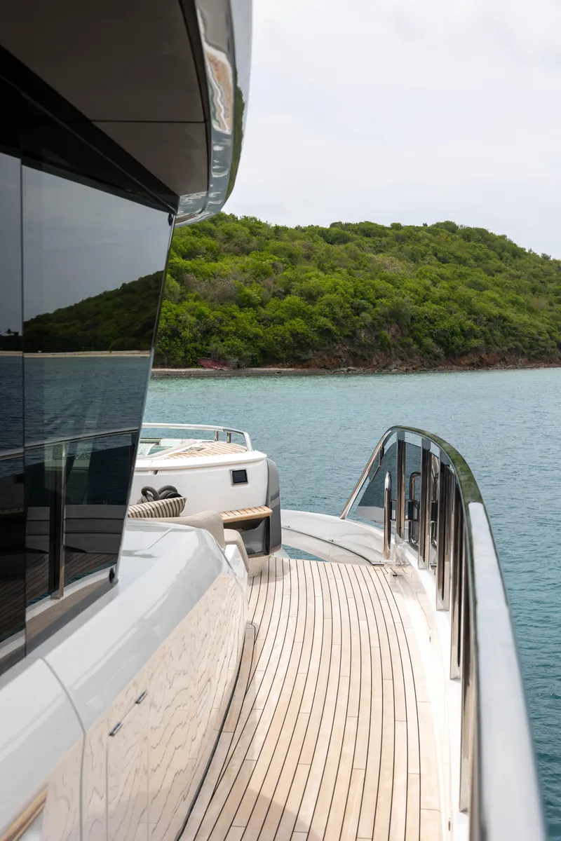 Slide: The Image of Luxury Princess X95 yacht deck with scenic ocean and lush green island view, 2021 model. - 47