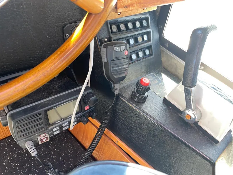 Slide: The Image of Control panel of a 1985 Nord West 900 boat with radio and throttle. - 17