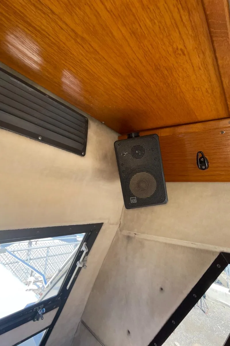 Slide: The Image of Interior of a 1985 Nord West 900 boat with speaker and wooden ceiling. - 20
