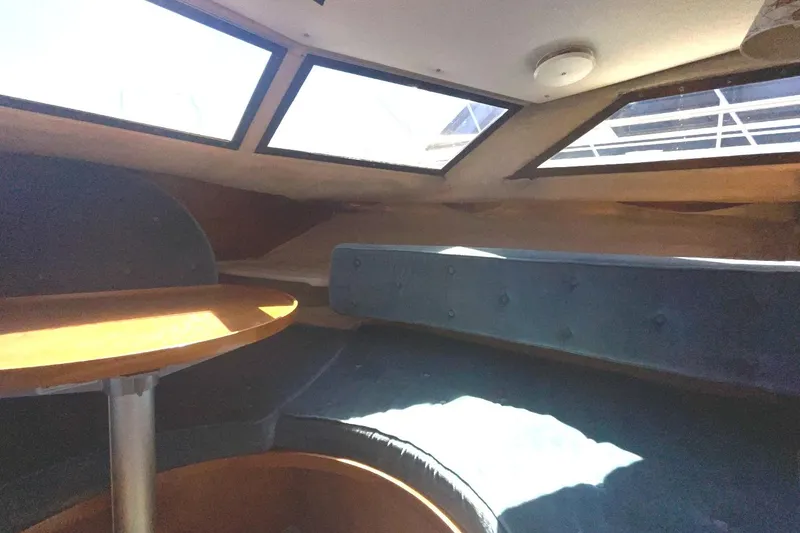 Slide: The Image of Interior of 1985 Nord West 900 boat with seating and windows. - 26