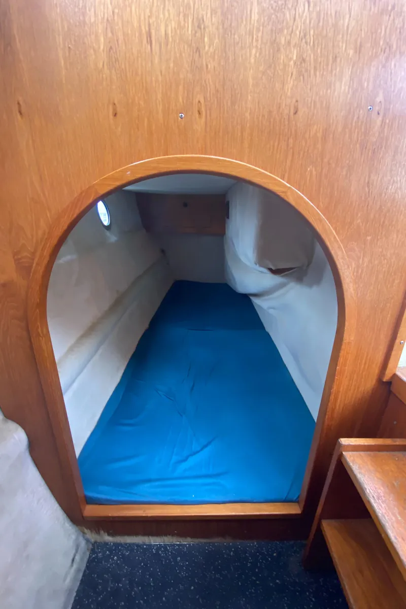 Slide: The Image of Cozy sleeping berth in 1985 Nord West 900 boat with wooden interior. - 28