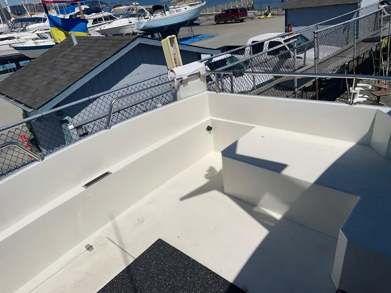 Slide: The Image of Nord West 900 boat deck, 1985 model, docked at marina with other boats. - 7