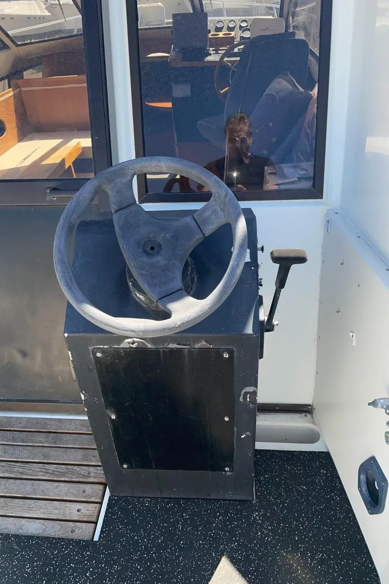 Slide: The Image of Steering wheel of a 1985 Nord West 900 boat. - 9