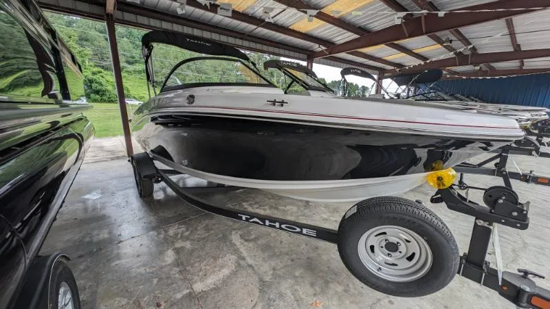 The Image of 2023 Tahoe 185 S boat on trailer in covered storage area. - 0