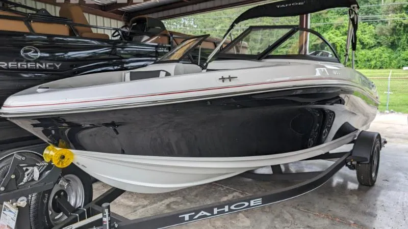Slide: The Image of 2023 Tahoe 185 S boat on trailer in storage facility. - 8