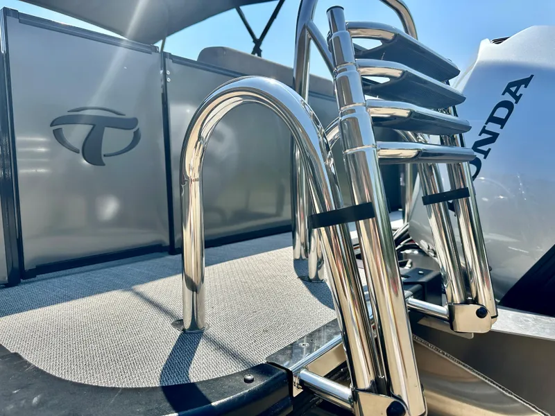 Slide: The Image of 2023 Tahoe Pontoon Cascade Cruise 23 FT Triple 25 with Honda engine and stainless steel ladder. - 9