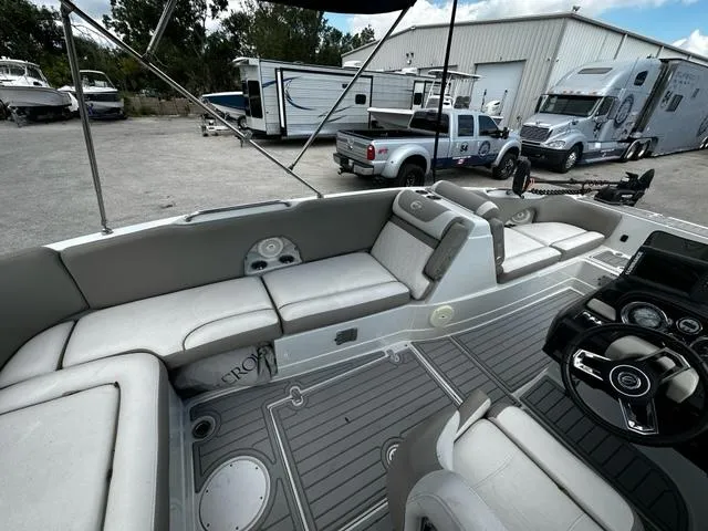 Slide: The Image of 2019 Crownline 205XS boat interior with gray seating and steering wheel. - 7