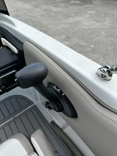 Slide: The Image of 2019 Crownline 205XS boat throttle control and interior details. - 8