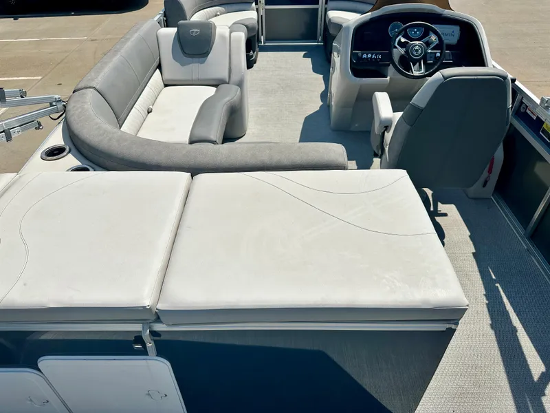 Slide: The Image of 2023 Tahoe Pontoon 23 FT Cascade Rear Fish Triple 25 interior with seating and helm. - 10