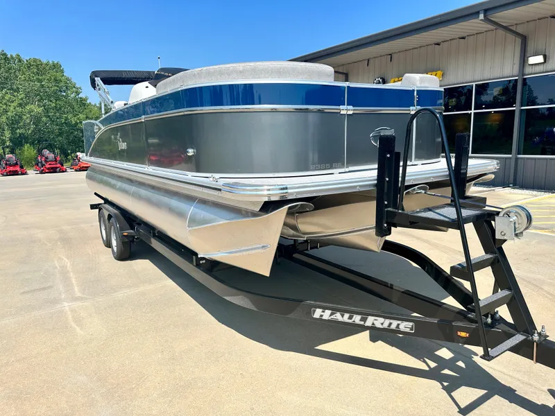 Slide: The Image of 2023 Tahoe Pontoon 23 FT Cascade Rear Fish Triple 25 on Haul Rite trailer. - 2