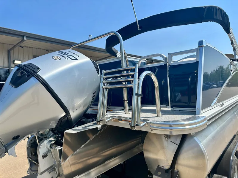 Slide: The Image of 2023 Tahoe Pontoon 23 FT Cascade Rear Fish Triple 25 with outboard motor. - 3