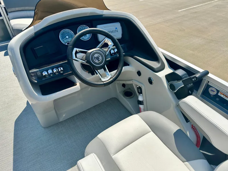 Slide: The Image of 2023 Tahoe Pontoon 23 FT Cascade Rear Fish Triple 25 helm with steering wheel and controls. - 6