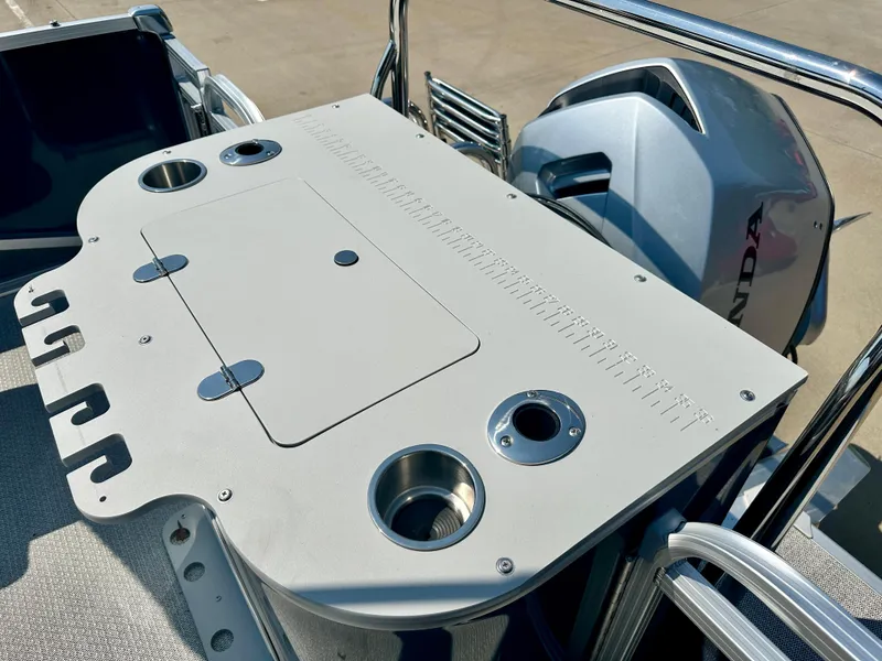 Slide: The Image of 2023 Tahoe Pontoon 23 FT Cascade Rear Fish Triple 25 fishing station with Honda outboard motor. - 9