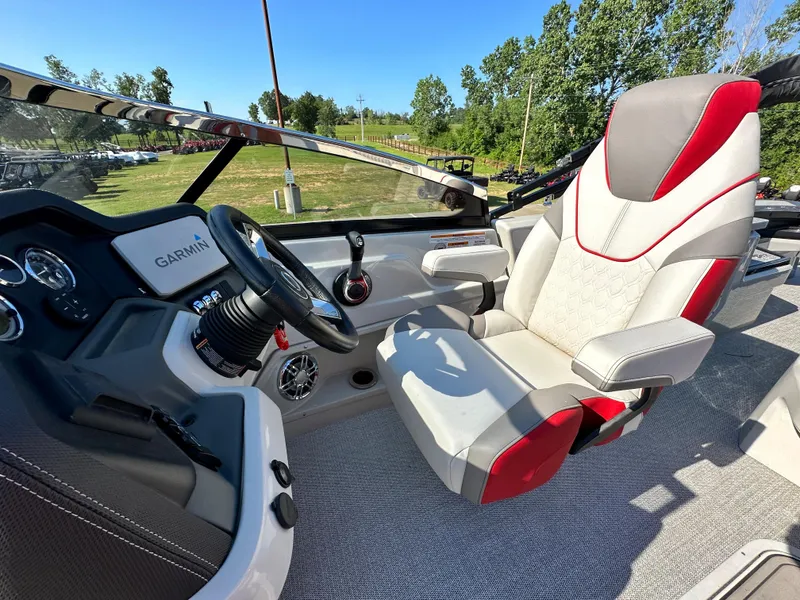 Slide: The Image of Captain's seat and helm of 2023 Tahoe Pontoon Cascade Versatile Rear Bench 25 FT Triple 25 SP. - 14