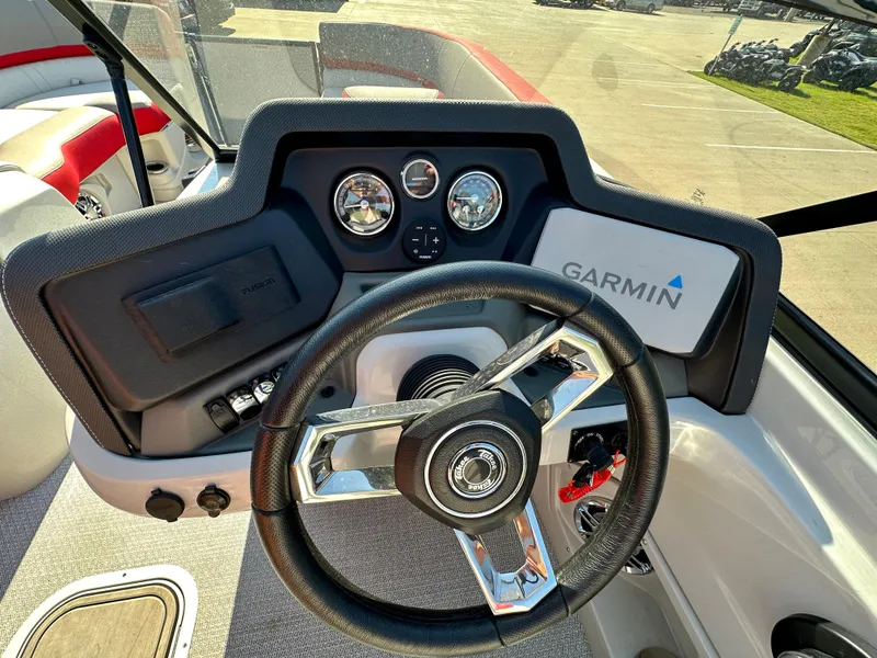 Slide: The Image of 2023 Tahoe Pontoon Cascade Versatile Rear Bench 25 FT Triple 25 SP steering console with Garmin navigation. - 15
