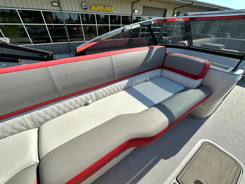 Slide: The Image of 2023 Tahoe Pontoon Cascade Versatile Rear Bench 25 FT Triple 25 SP, red and gray seating. - 16