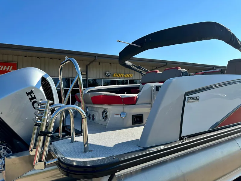 Slide: The Image of 2023 Tahoe Pontoon Cascade Versatile Rear Bench 25 FT Triple 25 SP, rear view with Honda engine. - 9