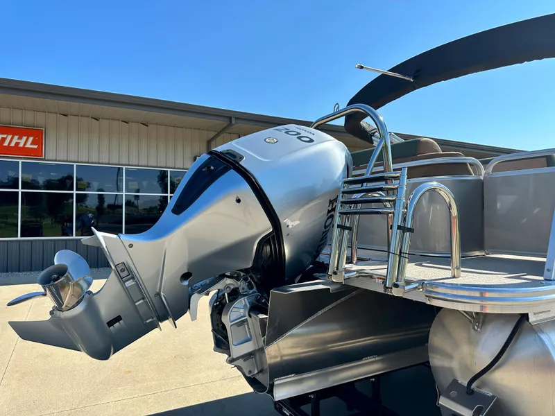 Slide: The Image of 2023 Tahoe Pontoon Cascade Versatile Rear Lounger with outboard motor. - 20