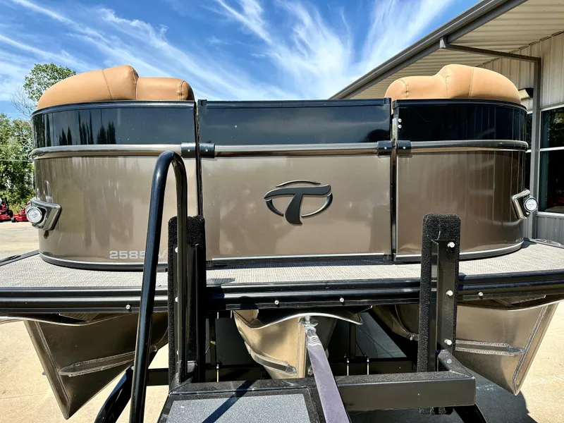Slide: The Image of 2023 Tahoe Pontoon 25FT Cascade VRL Tritoon, rear view, docked under a clear sky. - 4