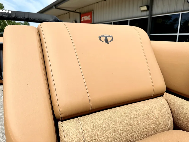 Slide: The Image of 2023 Tahoe Pontoon 25FT Cascade VRL Tritoon tan leather seat detail. - 6
