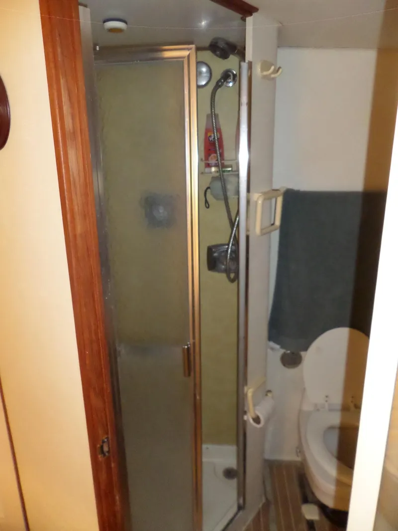 Slide: The Image of 1978 Bertram 42 Flybridge Motor Yacht bathroom with shower and toilet. - 17