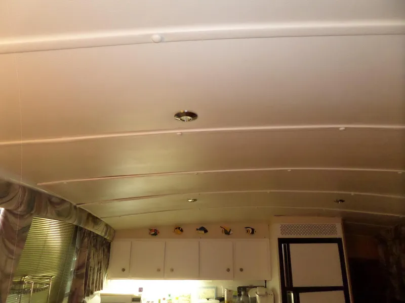 Slide: The Image of Interior ceiling of a 1978 Bertram 42 Flybridge Motor Yacht, featuring cabinets and decor. - 39