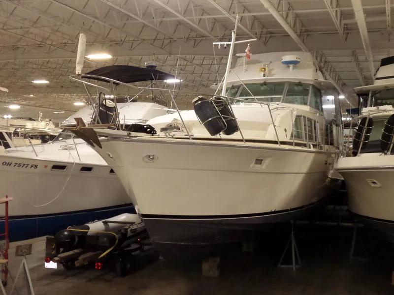 Slide: The Image of 1978 Bertram 42 Flybridge Motor Yacht in indoor storage facility. - 4