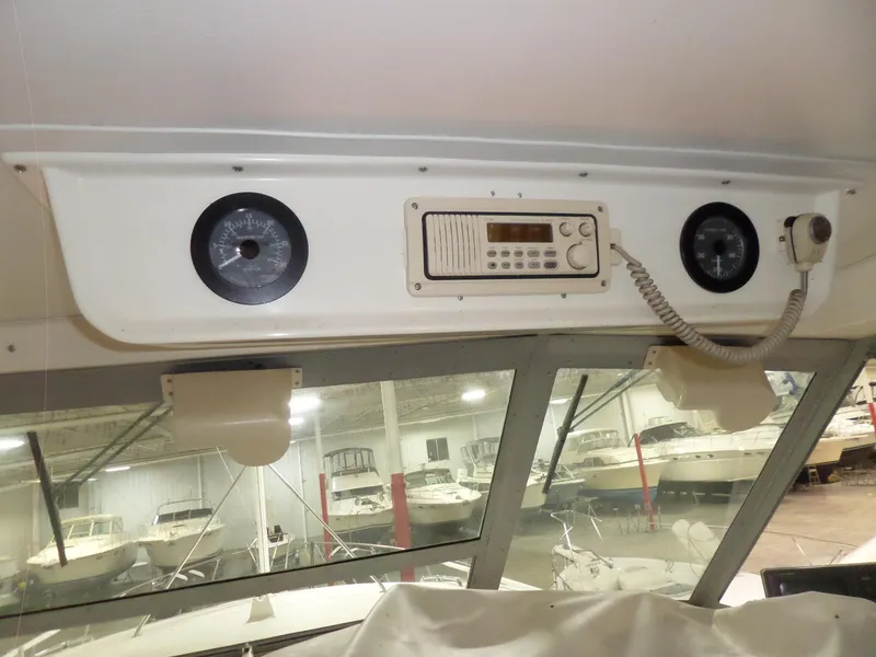 Slide: The Image of Interior view of a 1978 Bertram 42 Flybridge Motor Yacht with radio and speakers. - 42