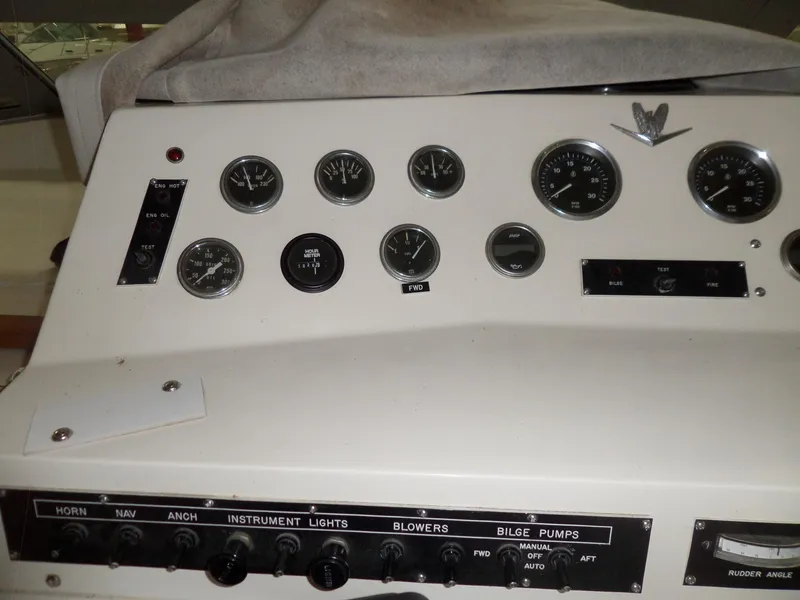Slide: The Image of Control panel of a 1978 Bertram 42 Flybridge Motor Yacht with gauges and switches. - 43