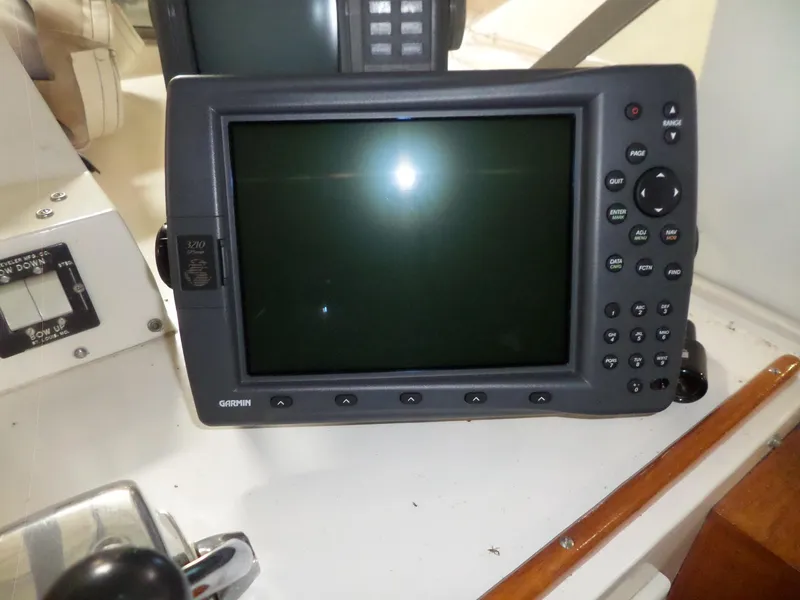 Slide: The Image of Garmin navigation system on 1978 Bertram 42 Flybridge Motor Yacht dashboard. - 46