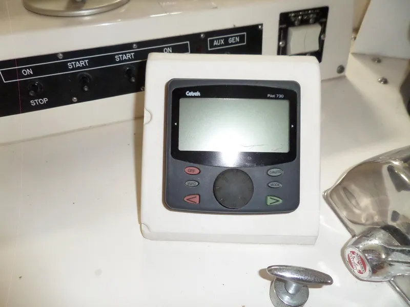 Slide: The Image of Control panel on 1978 Bertram 42 Flybridge Motor Yacht with electronic display and switches. - 49