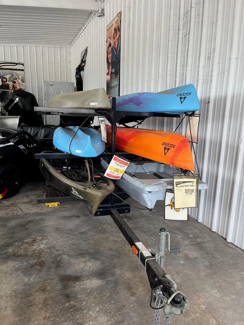 Slide: The Image of 2016 Trailer TXXKAYAKP with multiple kayaks in storage unit. - 1