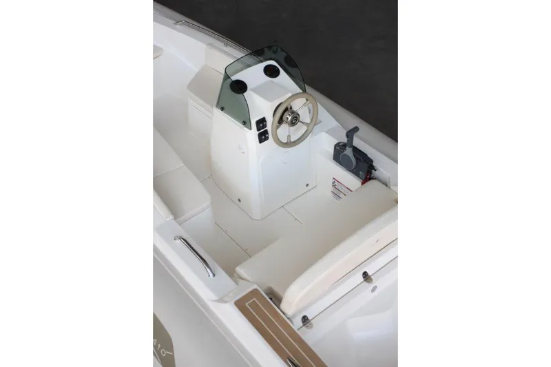 Slide: The Image of 2023 Capelli Tempest 410 Yacht Tender interior with steering console and seating. - 4