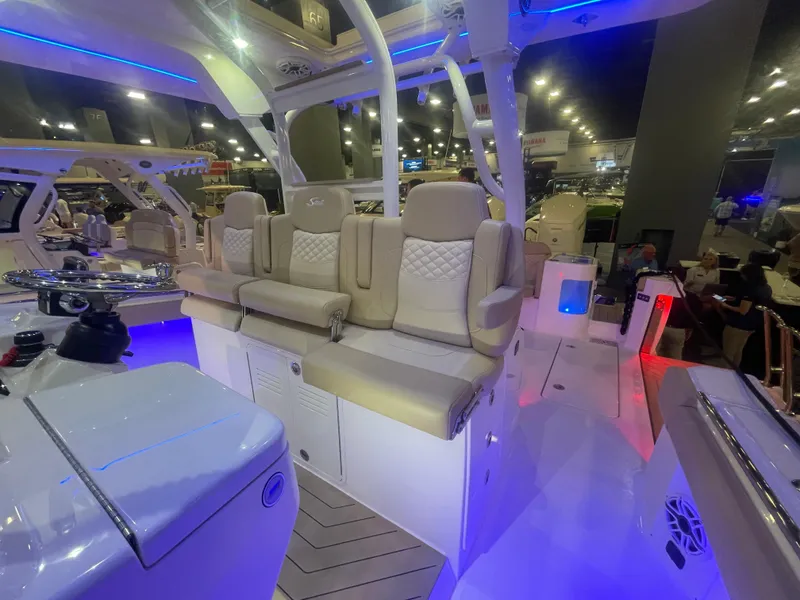 Slide: The Image of 2025 Scout 400 LXF luxury boat interior with illuminated seating and modern design. - 12