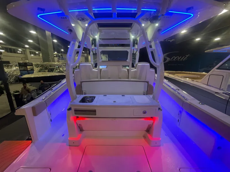 Slide: The Image of Interior view of 2025 Scout 400 LXF boat with blue and red LED lighting. - 14