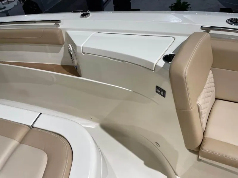 Slide: The Image of Interior seating of 2025 Scout 400 LXF boat with beige upholstery. - 20