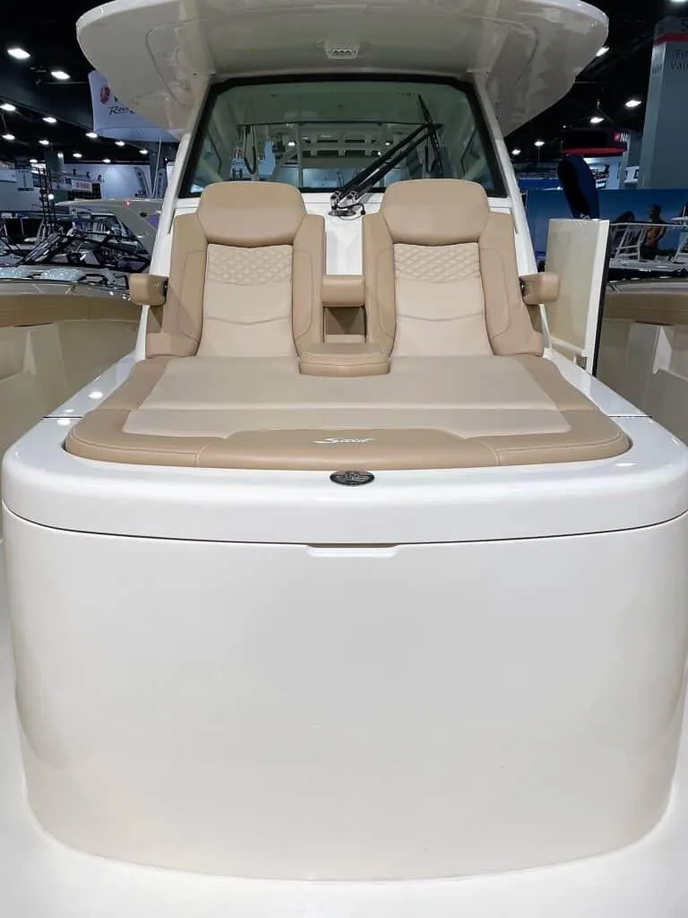 Slide: The Image of 2025 Scout 400 LXF boat with beige seating and modern design. - 21